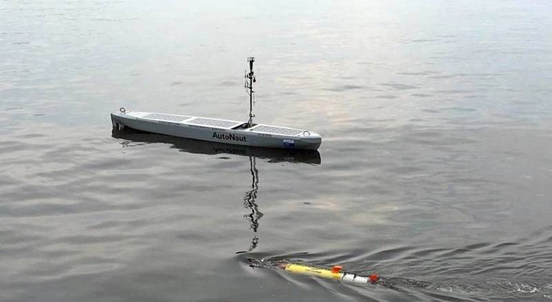 AutoNaut “shepherding” the Remus UUV during operations (the shepherding back to a safe zone was done mostly when the UUV was underwater). Photo from AutoNaut.